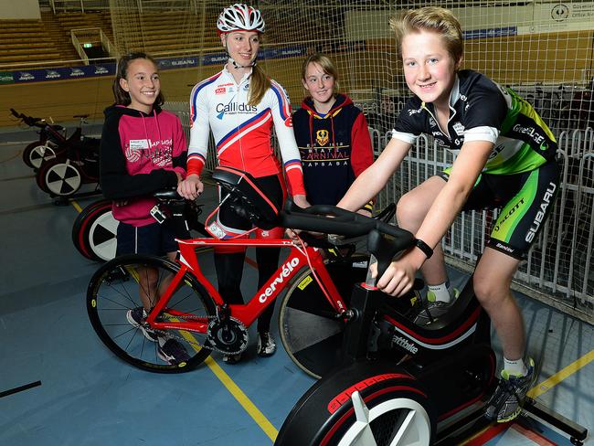 Angus Miller tries out the bike as part of the South Australian Sports Institute talent search, watched by Lauren Clifton, Beth Prestwood and Chloe Moran. Photo: Mark Brake.