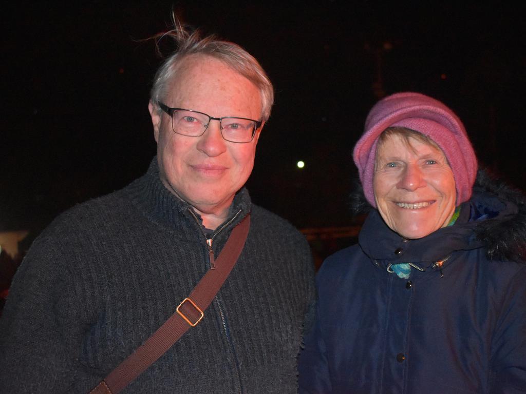 Ian Bardon and Val Butler soaking up some fireside warmth at the 2021 Killarney Bonfire Night.