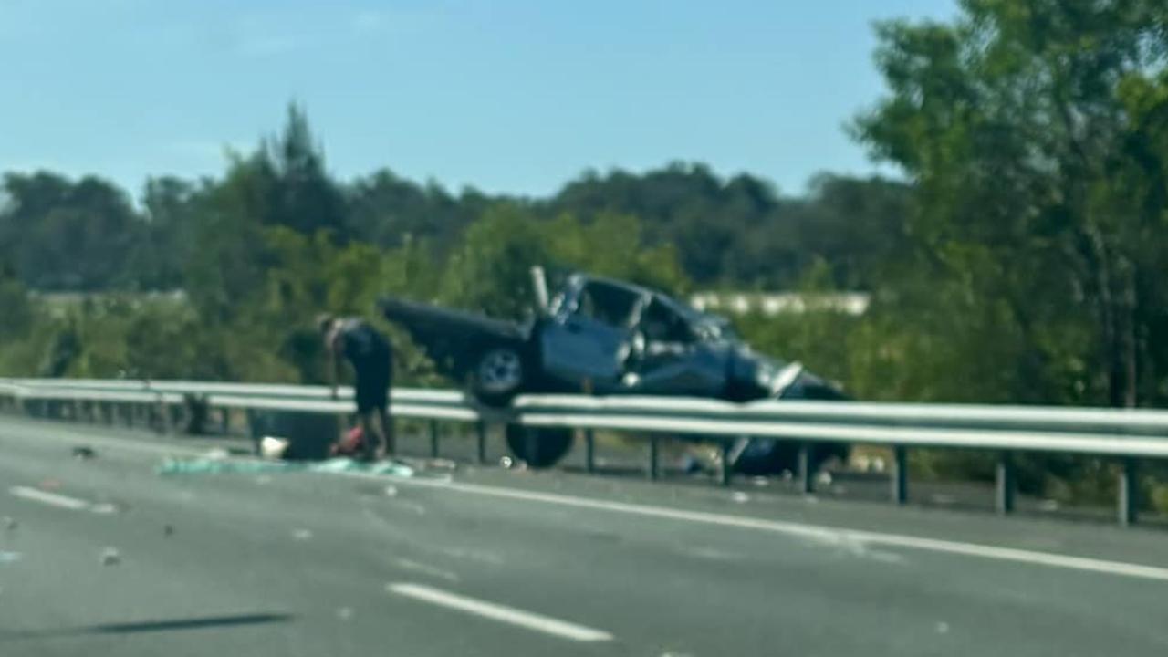 Paramedics rush to ute rollover on Bruce Hwy exit