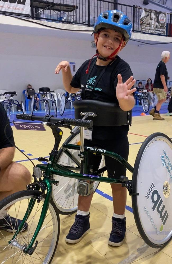 Aston Binskin, who lives with a form of cerebral palsy, vision impairment and a brain tumour, at Frame Running Wollongong.