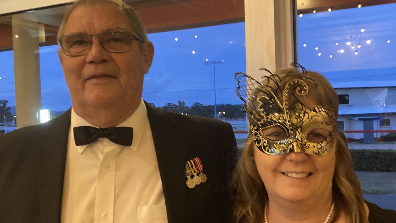 Greg and Julie McLaughlin celebrate at the Gympie RSL Masked Ball, April 29 2023.