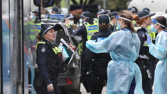 Medical staff and public health officials will support police during the five-day lockdown of the towers. Picture: David Crosling