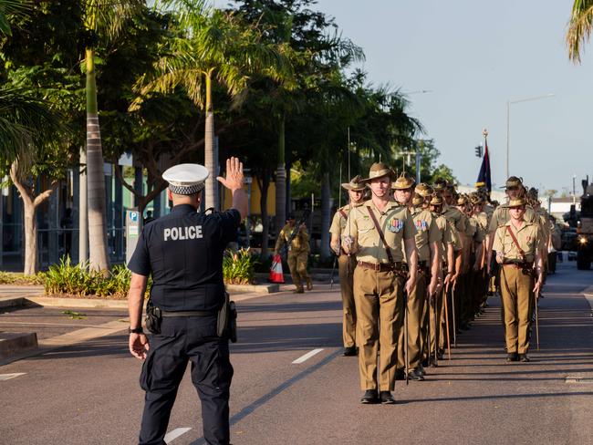 NT Police Officer issues the Challenge to Lieutenant Colonel Colclough presenting an official scroll giving 8th/12th Regiment the right to parade through the streets with swords drawn, bayonets fixed, drums beating, band playing and the banner flying at the Freedom of Entry through Palmerston on Friday. Picture: Pema Tamang Pakhrin