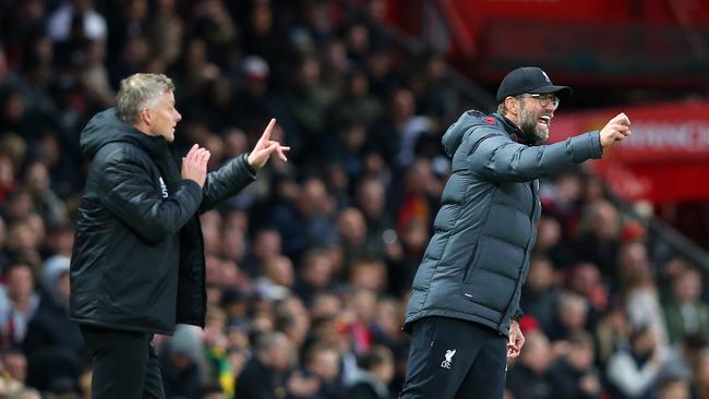 Manchester United manager Ole Gunnar Solskjaer (left) and Liverpool boss Jurgen Klopp issue instructions on the sidelines. Picture: AP
