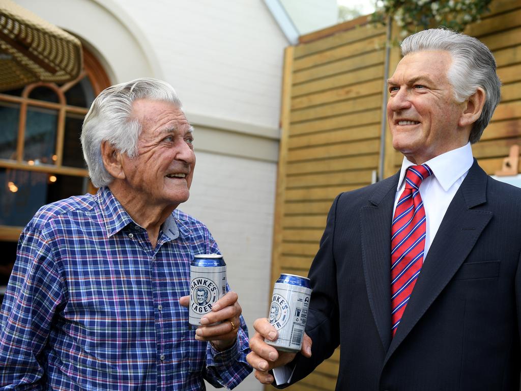Former prime minister Bob Hawke poses for a photograph with a wax figure of himself at a media event to celebrate his 88th birthday, in Sydney, Thursday, December 7, 2017. Mr Hawke was presented with a wax sculpture of himself holding a can Hawkes Brewing Co. beer. Picture: Dan Himbrechts