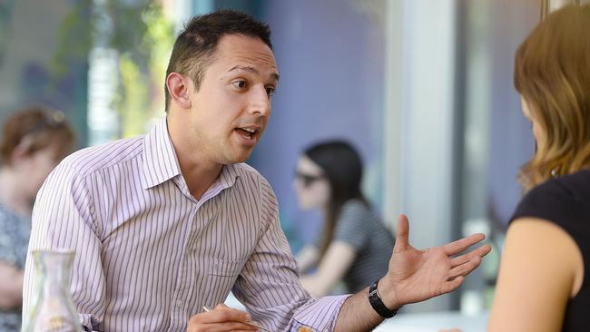 Arman Abrahimzadeh talks with Lauren Novak at The Loose Caboose cafe Hindmarsh. Picture: Bianca De Marchi