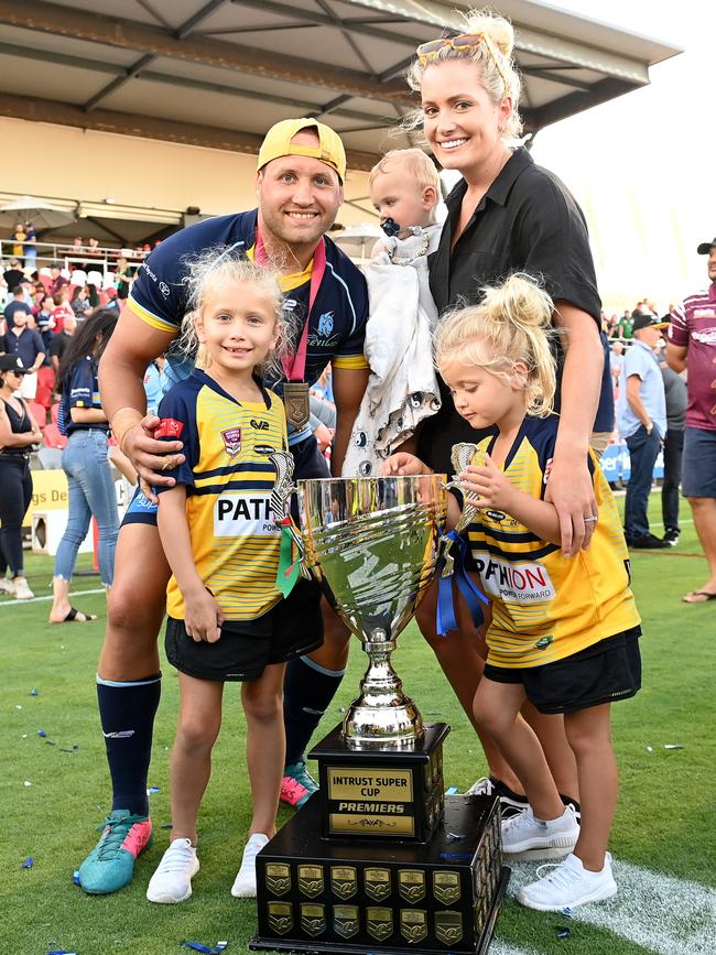 BRISBANE, AUSTRALIA - OCTOBER 10: Tyrone Roberts of the Devils celebrates victory with his family after the 2021 QRL Intrust Super Cup Grand Final match between the Norths Devils and the Wynnum-Manly Seagulls at Moreton Daily Stadium on October 10, 2021, in Brisbane, Australia. (Photo by Bradley Kanaris/Getty Images)