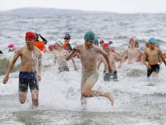 Competitors in the grade 5 race sprint out of the water.