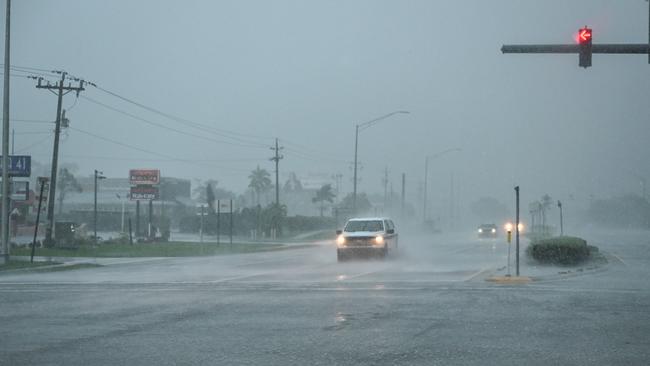 A car drives through the heavy rain in Fort Myers, Florida, as Hurricane Milton approaches. Picture: AFP.