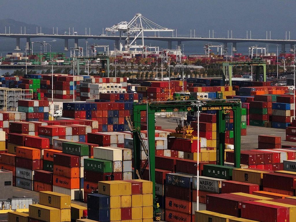OAKLAND, CALIFORNIA - APRIL 28: In an aerial view, shipping containers are stacked at the Port of Oakland on April 28, 2025 in Oakland, California. American importers are seeing a surge in canceled sailings by freight ships out of China as the Trump administration's tariffs continue to impact the world's economy.   Justin Sullivan/Getty Images/AFP (Photo by JUSTIN SULLIVAN / GETTY IMAGES NORTH AMERICA / Getty Images via AFP)