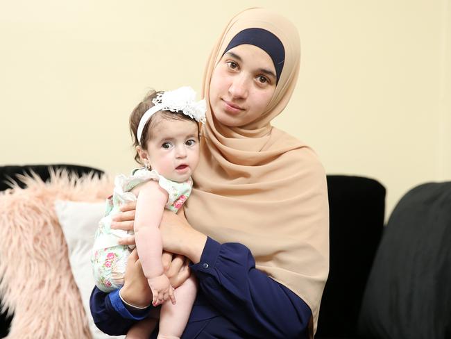 Reema El Qassem with her 13-month-old daughter Fatima Sari, who suffers from Prader-Willi syndrome. The mother of three urges Inner West council to fund specialised neonatal equipment. Picture: Tim Hunter