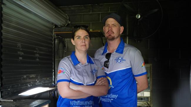 Secretary Ali McArthur and her husband Ty stand in the aftermarth of the burnt remains of the Dolphin Soccer Club home canteen Picture: Heidi Petith