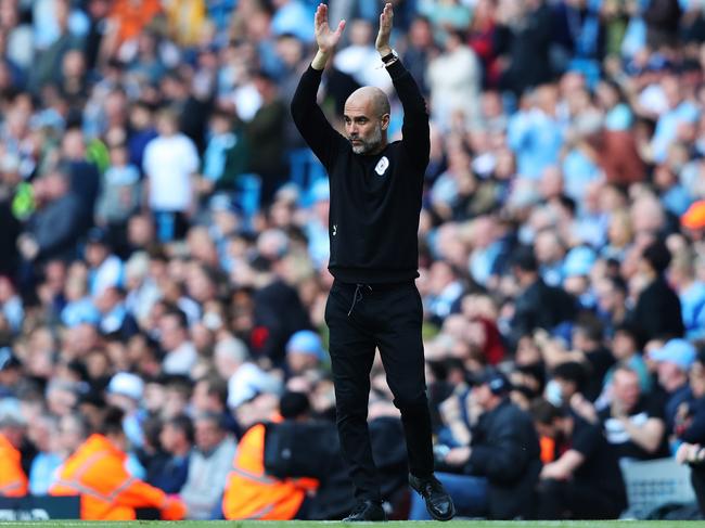 Pep Guardiola urges on his Manchester City side and the crowd at Etihad Stadium. His team now has a strong lead at the top of the EPL ladder with just three games remaining. Picture: Alex Livesey/Getty Images