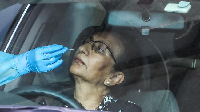 A woman undergoes a test at a pop-up COVID-19 clinic at the Broadmeadows Hume City Council Carpark in Melbourne, Victoria. Picture: NCA NewsWire / Ian Currie