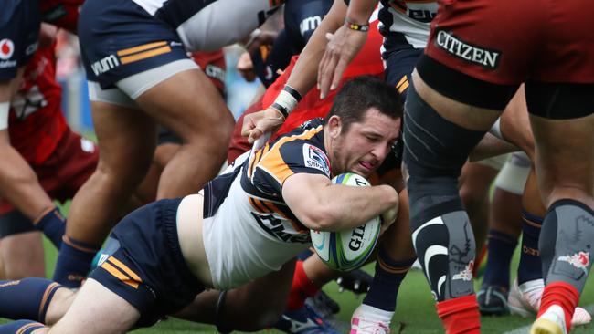 Connal McInerney on his way to one of his three tries. Picture: Takashi Aoyama/Getty Images