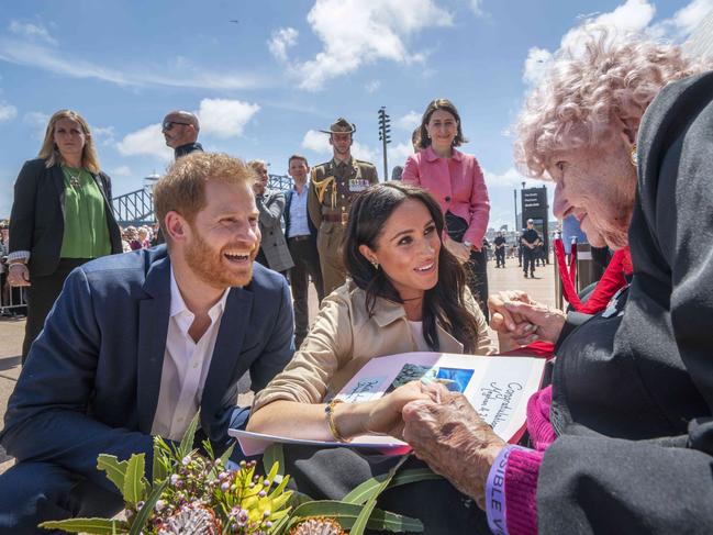 Harry and Meghan talk to Daphne Dunn outside the Opera House. Picture: Michelle Haywood