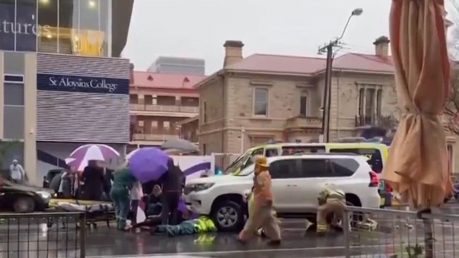 A young girl and woman have been rushed to hospital after being hit by a car during peak hour on Angas Street. Major Crash officers are investigating. Picture: 7NEWS