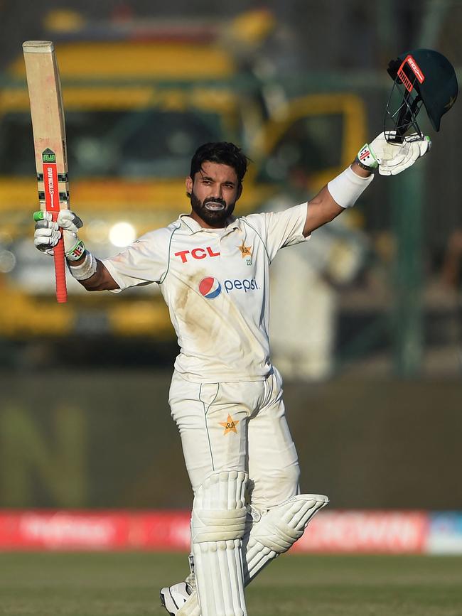 Pakistan's Mohammad Rizwan celebrates after scoring a century late on day five.