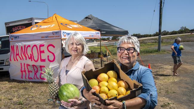 Gail Roche and Janelle Bray volunteer at the mango stall.