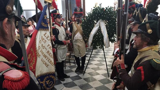 Re-enactors dressed in Napoleonic-era costumes stand around the grave of Joachim Murat during the commemoration ceremony for the 200th anniversary of the his death. Picture: AFP