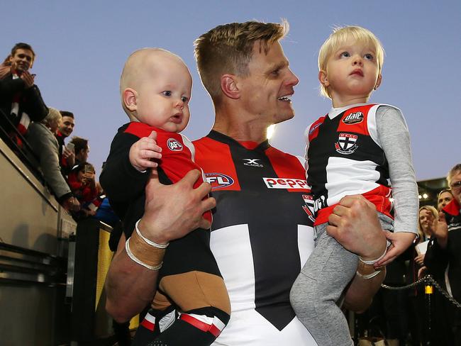 AFL Round 23. Richmond vs St Kilda at the MCG. St Kilda's Nick Riewoldt walks down the race with sons James and William after playing his final game today  . Pic: Michael Klein