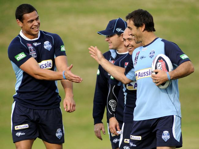 Timana Tahu (L) high-fives Andrew Johns (R) during a NSW State of Origin team training session at WIN Stadium, Wollongong.