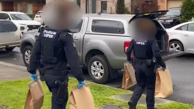 Police make seizures during the arrests over the shooting of Sam Abdulrahim. Picture: Victoria Police