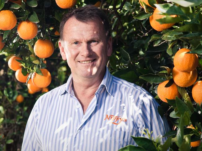 NIppys fruit Juice.The production of fruit juices. Jeff Knispel at an orchard near Wakerie , in South Australias Riverland.