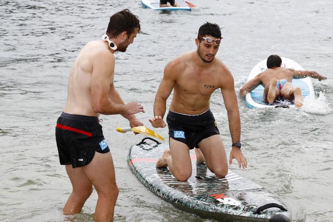 Gold Coast Suns players Jordan Murdoch (left) and Brayden Fiorini (right) training at Palm Beach. Picture: Tertius Pickard