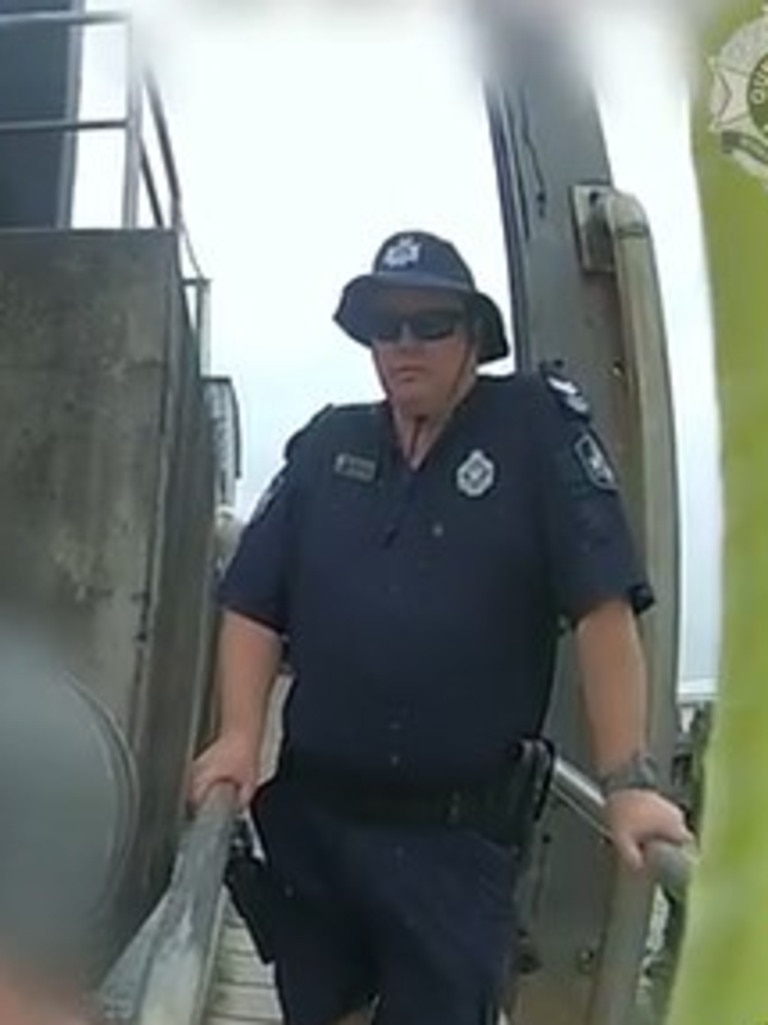 Police quizzed and arrested the man on shore. Picture: 7 News