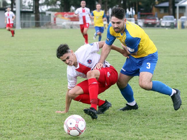 Nerang’s Ethan Toewes and Broadbeach’s Josh Riis. Picture: Richard Gosling