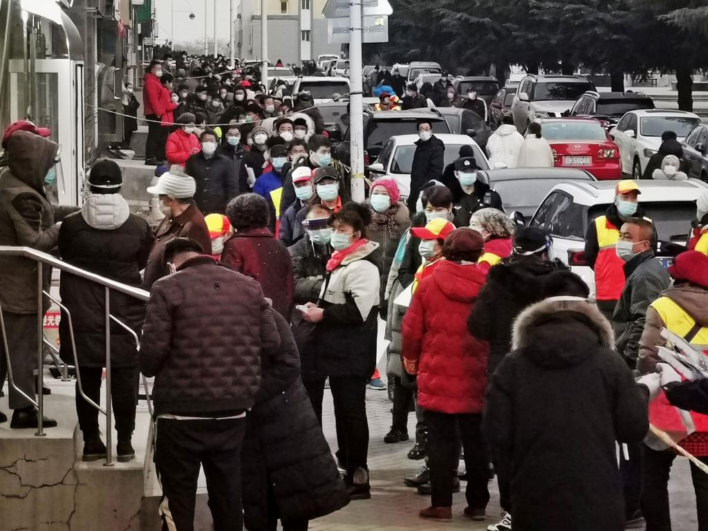 Residents wait to be tested for the coronavirus in northeastern China. Picture: AFP