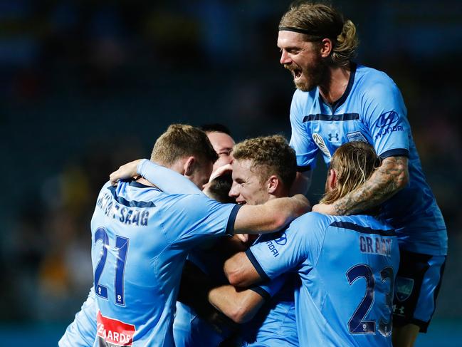 Marco Tilio of Sydney celebrates scoring a goal with team mates during the Round 20 A-League match between the Central Coast Mariners and the Sydney FC at Central Coast Stadium in Gosford, Sunday, February 23, 2019. (AAP Image/Brendon Thorne) NO ARCHIVING, EDITORIAL USE ONLY