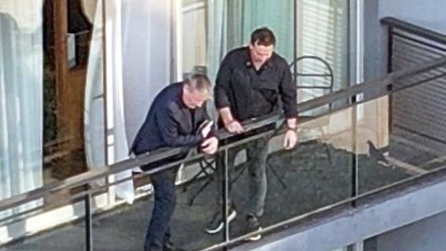 Geoff Payne, left, the father of the late musician Liam Payne, is spotted standing on the balcony from which his son tragically fell, looking down at the deck below. Picture: BACKGRID Australia