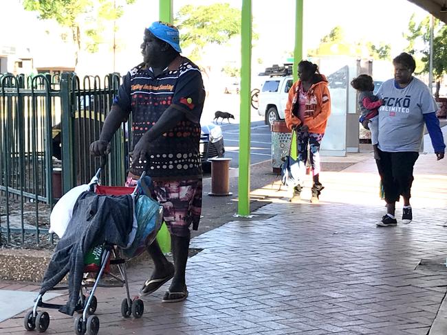 A man appears to use a stroller to transport beer. There is no suggestion that anybody pictured above abuses women or children. Picture: Tricia Watkinson