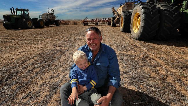 Barley farmer Barry Large and son Braxton on his farm at Miling, WA. Picture: Colin Murty/The Australian