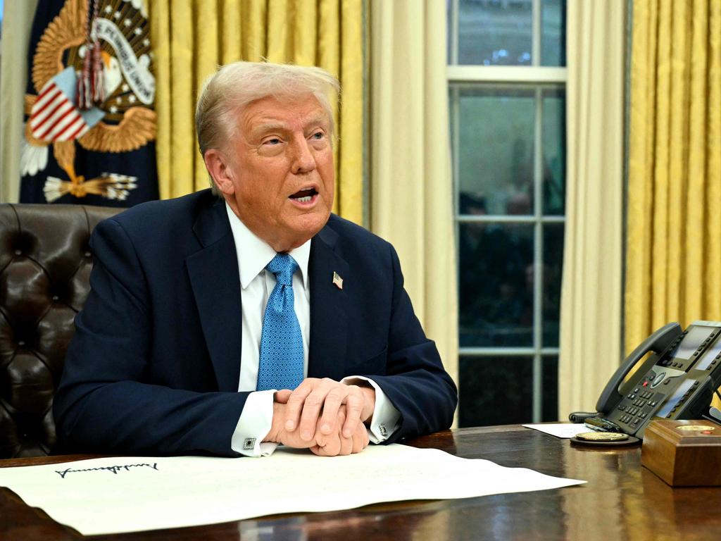 US President Donald Trump speaks to the press after signing an executive order in the Oval Office of the White House in Washington, DC on January 31, 2025. (Photo by Mandel NGAN / AFP)