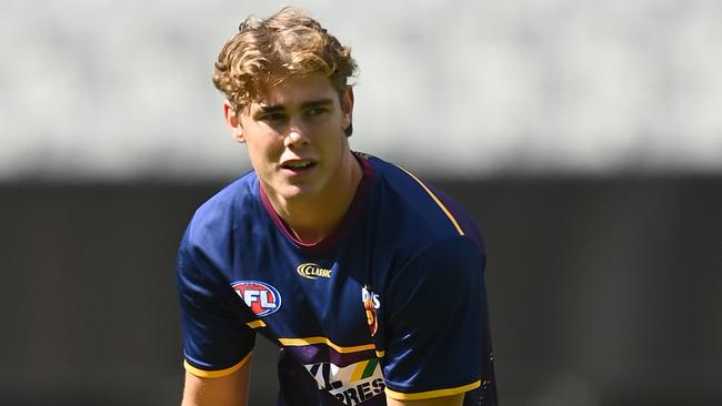 Deven Robertson warms up before making his Brisbane Lions debut as a late inclusion.