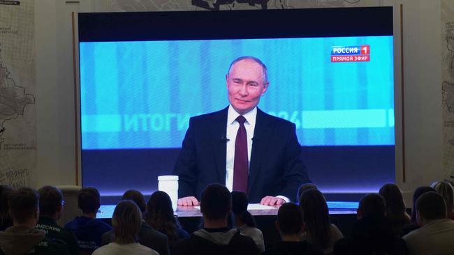 Activists of various youth organisations of the Donetsk People's Republic watch a live broadcast of Russian President Vladimir Putin's annual end-of-year press conference at a palace of culture in Donetsk, Russian-controlled Ukraine, on December 19, 2024. (Photo by STRINGER / AFP)