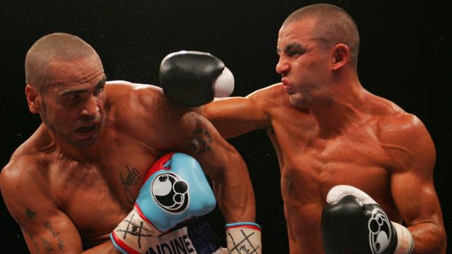 Anthony Mundine (left) and Sam Soliman fight in Sydney in 2007.