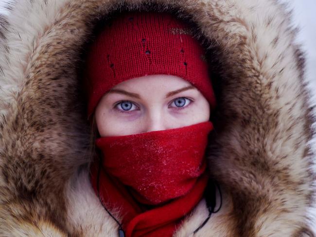 ONE TIME WEB USE ONLY - Credit: Amos Chapple/REX/Shutterstock/Australscope Mandatory Credit: Photo by Amos Chapple/REX/Shutterstock (2087439h) A young student poses for a portrait at a bus station in Yakutsk Village of Oymyakon, which is considered to be the coldest permanently inhabited settlement in the world, Russia - Jan 2013 *Full story: http://www.rexfeatures.com/nanolink/jpod If you thought it was cold where you are at the moment then a visit to the Russian village of Oymyakon and city of Yatutsk might just change your mind. With the average temperature for January a blisteringly cold -50c it is no wonder Oymyakon is the coldest permanently inhabited settlement in the world. Oymyakon lies a two day drive from the city of Yakutsk, the regional capital, which has the coldest winter temperatures for any city in the world. Ironically, Oymyakon actually means "non-freezing water" due to a nearby hot spring. The village was originally a stopover for reindeer herders who would water their flocks from the thermal spring. Known as the "Pole of Cold", the coldest ever temperature recorded in Oymyakon was a mind numbing -71.2c. This is the lowest recorded temperature for any permanently inhabited location on Earth and the lowest temperature recorded in the Northern Hemisphere.