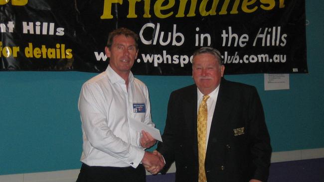 Former chairman Dennis Montgomery presenting president of WPH Cherrybrook Soccer Club, Ian Porter, with a cheque back in 2008.
