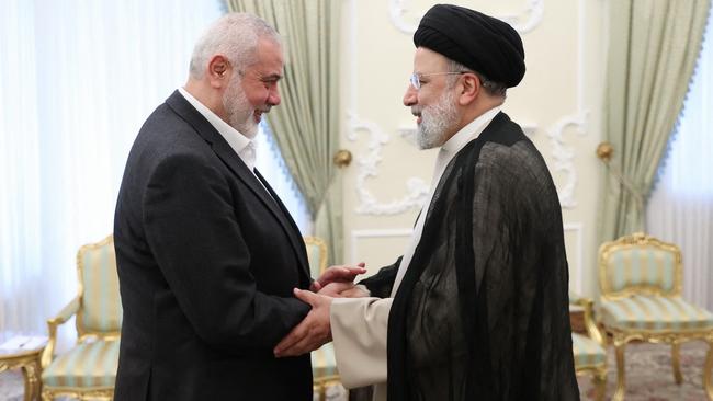 Hamas political leader Ismail Haniyeh and Iranian president Ebrahim Raisi, who are both now dead, in March. Picture: AFP