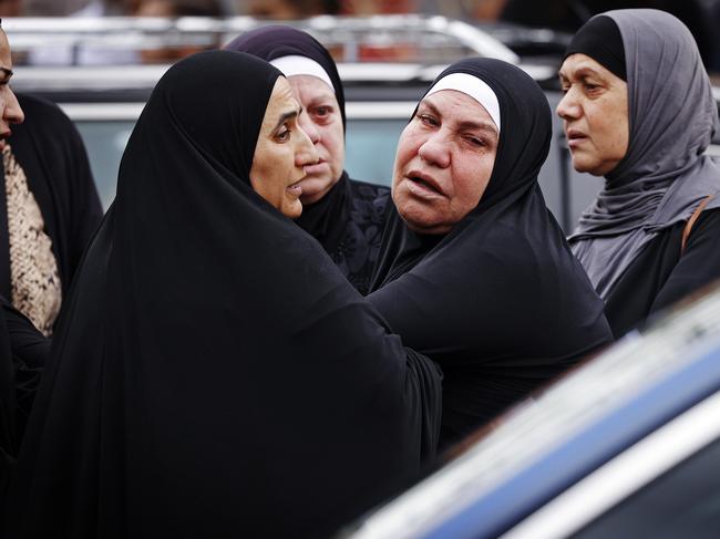 Emotional mourners had to be comforted at the service in Lakemba. Picture: Sam Ruttyn