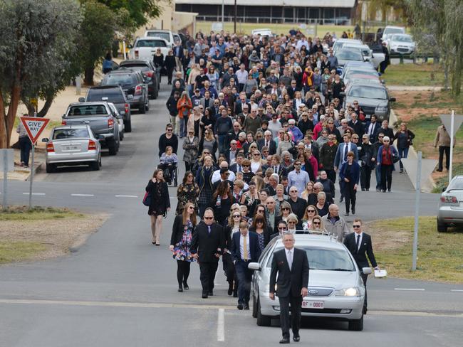 A crowd of mourners follows Kirsty Boden’s hearse after her funeral. Picture: AAP/Brenton Edwards