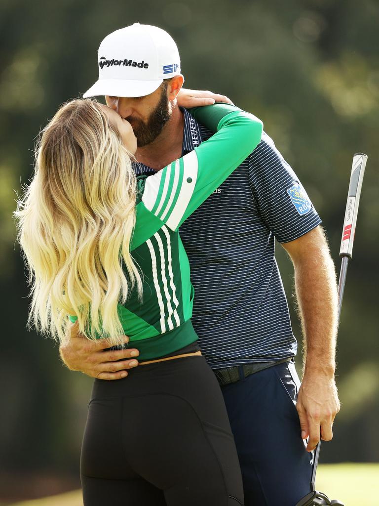 Dustin Johnson of the United States kisses fiance Paulina Gretzky after winning the Masters.