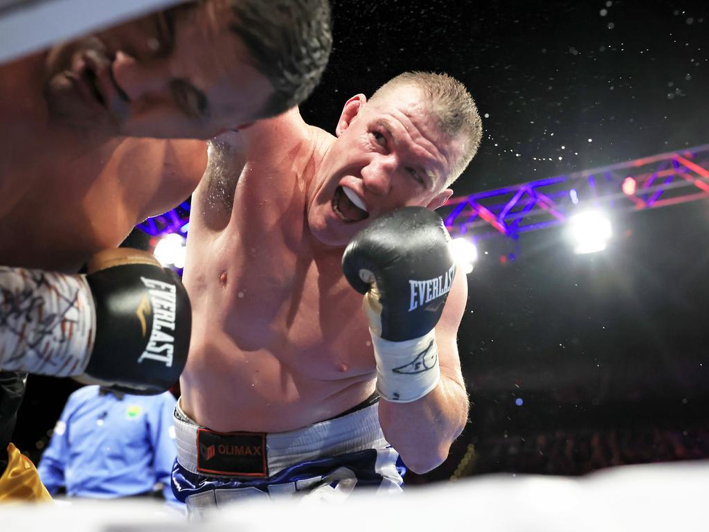 Paul Gallen throws a punch at Justin Hodges during his final fight. Picture: Mark Evans/Getty Images