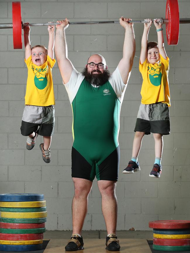 Weightlifter Damon Kelly trains with his sons Tom, 3 and Paddy, 5. Photo: Liam Kidston.