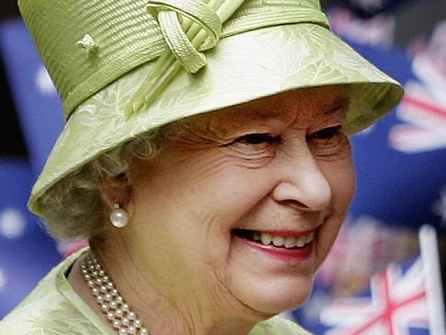 UPLOADED IMAGE - SYDNEY, NSW - MARCH 13: Her Majesty Queen Elizabeth ll smiles amongst Australian flags being waved by the crowd after the Commonwealth Day Service March 13, 2006 in Sydney, Australia. The Queen and Prince Philip are on a five-day visit to Australia where she will officially open the Commonwealth Games in Melbourne. (Photo by Rob Griffith-Pool/Getty Images)