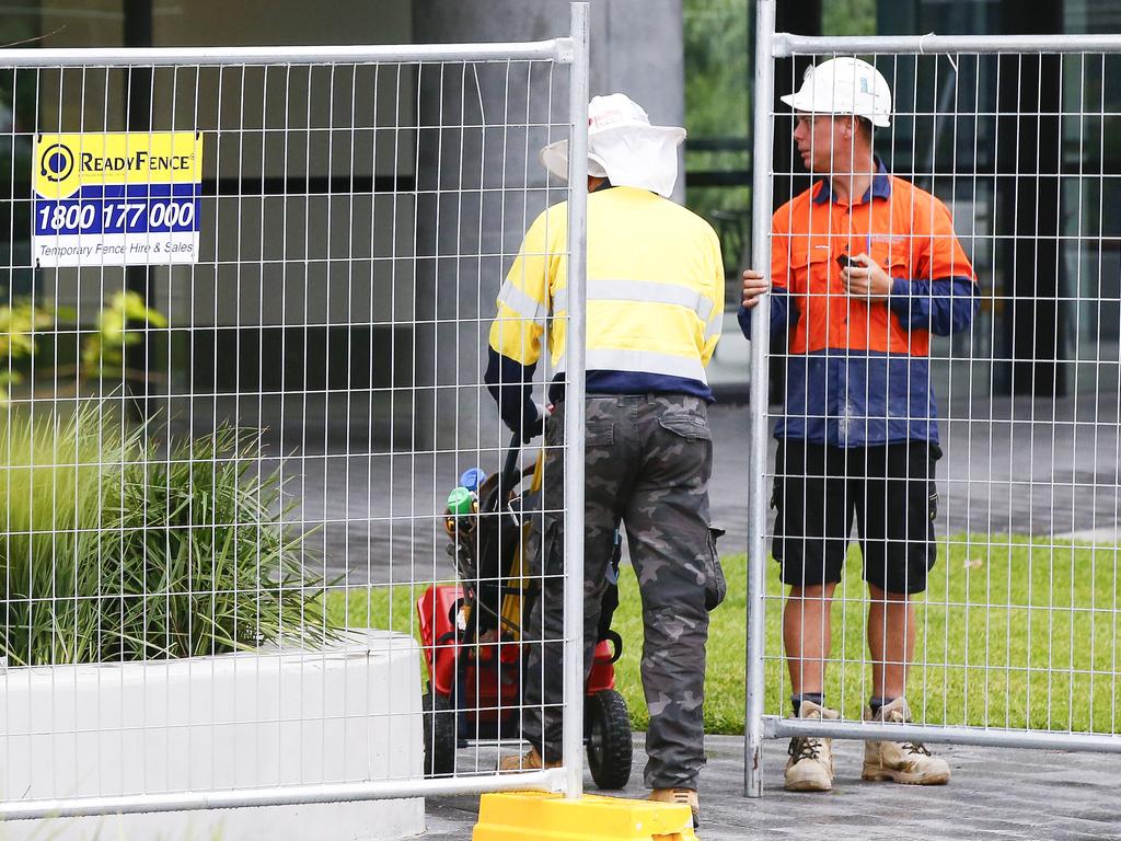 Workers arrive at the embattled tower with equipment this week. Picture: Dylan Robinson